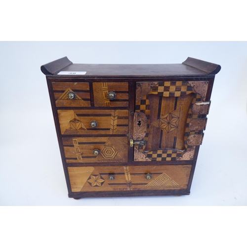 38 - An early 20thC Japanese table-top collector's cabinet, finished in a variety of exotic woods, incorp... 