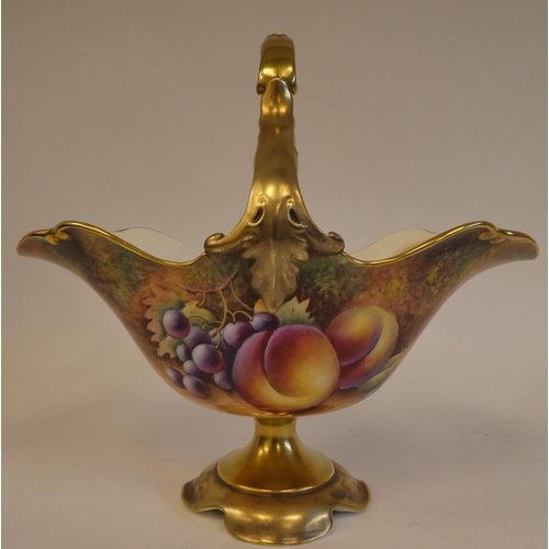 4 - A Royal Worcester china pedestal basket vase with a fixed loop handle, decorated in colours and gild... 