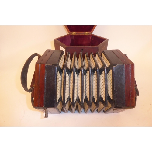 43 - A Lachenal & Co of London, hexagonal cased concertina, in a fitted wooden box