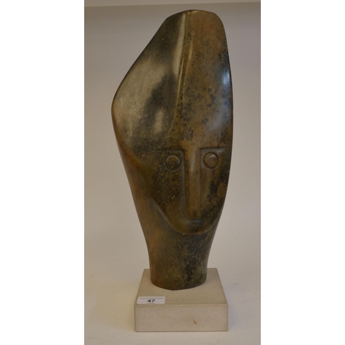 47 - Henry Munyaradzi - a multi-coloured carved stone sculpture, a head  bears an inscribed signature, on... 