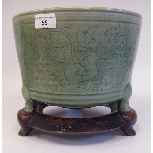 55 - A late 19thC Chinese celadon glazed, etched porcelain jardinière of tapered form with an inve... 