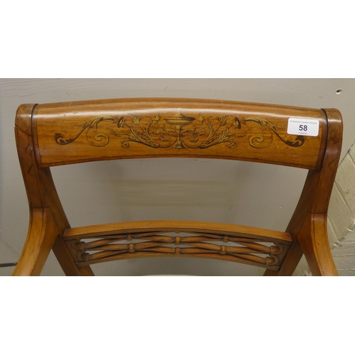 58 - An Edwardian Regency inspired, satinwood framed elbow chair with a decoratively painted crest rail, ... 