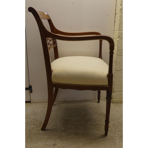 58 - An Edwardian Regency inspired, satinwood framed elbow chair with a decoratively painted crest rail, ... 