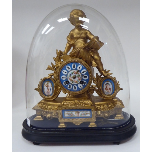 60 - A late 19thC French gilded spelter cased mantel clock, featuring a child reading a book, painted por... 