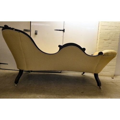 62 - A late Victorian walnut framed chaise longue, button upholstered in beige fabric, raised on cabriole... 