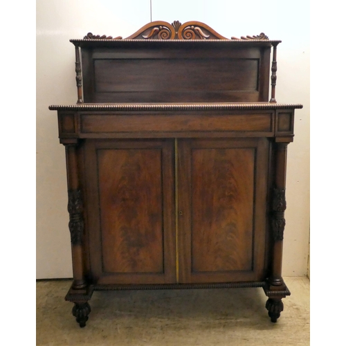 63 - A William IV mahogany chiffonier with a raised back, incorporating a shelf over a frieze drawer and ... 