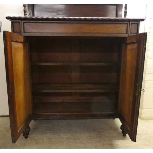 63 - A William IV mahogany chiffonier with a raised back, incorporating a shelf over a frieze drawer and ... 