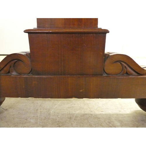 64 - A William IV mahogany desk, the top with a gallery over five drawers, raised on opposing pillar upri... 