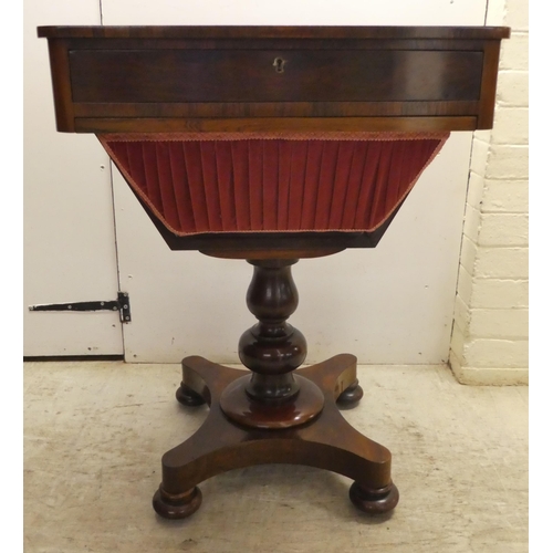 65 - An early Victorian rosewood sewing table with two drawers and a wool basket, raised on a pedestal ba... 