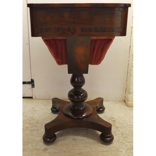 65 - An early Victorian rosewood sewing table with two drawers and a wool basket, raised on a pedestal ba... 