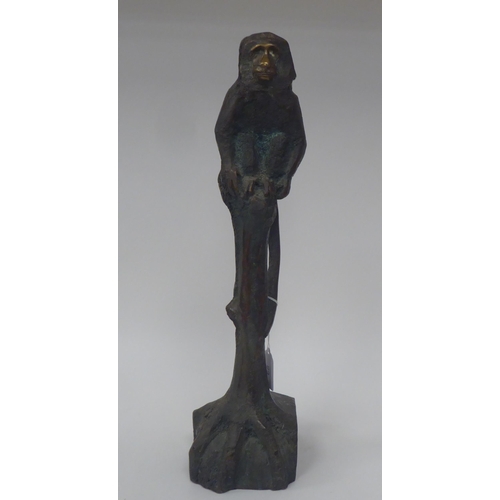 68 - Chris Price - a cast and patinated bronze study of a monkey, seated on a tree stump  bears an inscri... 