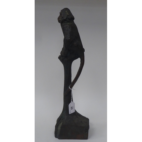 68 - Chris Price - a cast and patinated bronze study of a monkey, seated on a tree stump  bears an inscri... 