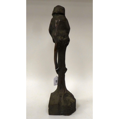 68 - Chris Price - a cast and patinated bronze study of a monkey, seated on a tree stump  bears an inscri... 