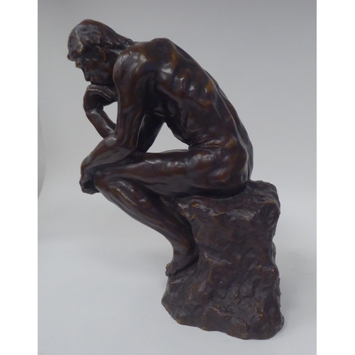 73 - After A Rodin - a cast and patinated bronze figure 'The Thinker'  bears an impressed signature  14