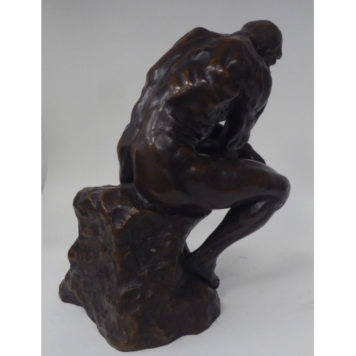 73 - After A Rodin - a cast and patinated bronze figure 'The Thinker'  bears an impressed signature  14