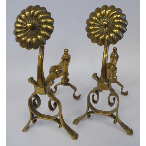 74 - A pair of Arts & Crafts period brass andirons or hearth implement rests with rosette capitals  1... 