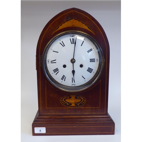 8 - An Edwardian mahogany, satinwood string inlaid and marquetry cased mantel clock with a lancet top an... 