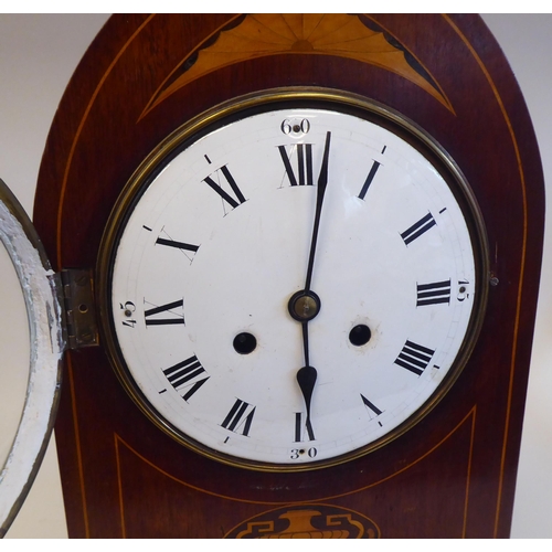 8 - An Edwardian mahogany, satinwood string inlaid and marquetry cased mantel clock with a lancet top an... 