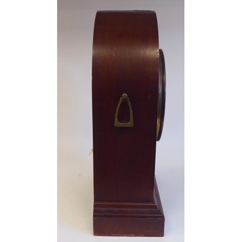 8 - An Edwardian mahogany, satinwood string inlaid and marquetry cased mantel clock with a lancet top an... 