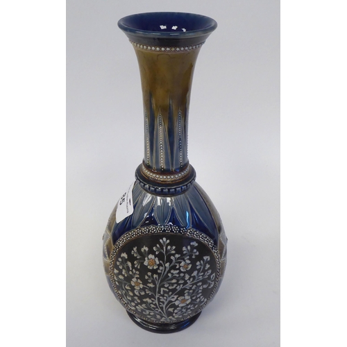 85 - A Doulton Lambeth stoneware bottle vase of ovoid form with a long, narrow neck and flared rim, decor... 