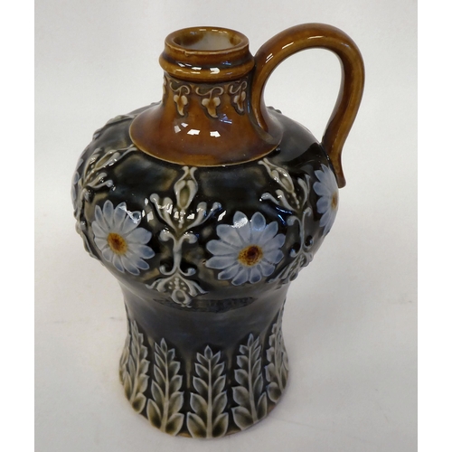 90 - A Royal Doulton stoneware liqueur flask of waisted, bulbous form with a narrow neck and strap handle... 