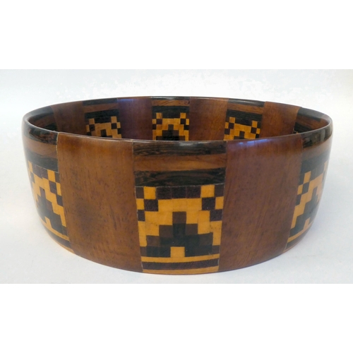 91 - An early 20thC turned fruitwood bowl with straight sides and geometrically arranged marquetry panels... 