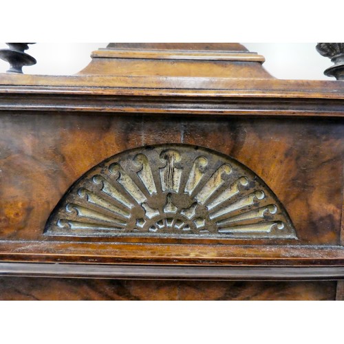 237 - A late 19thC burr walnut cased mantel clock with a domed top, brass finials, grilles and mounts; the... 