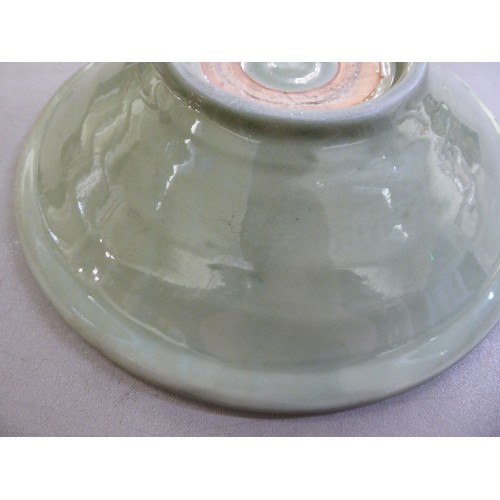 54 - A late 19thC Chinese celadon glazed porcelain, footed, shallow dish with faintly ribbed sides  12