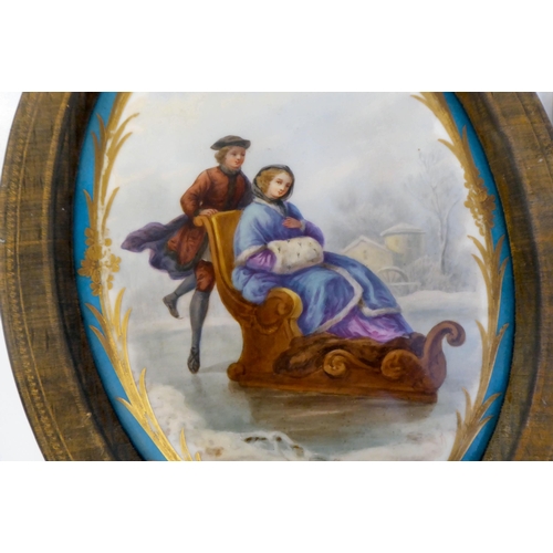 298 - A pair of late 19thC Continental painted porcelain plaques, one featuring a young woman on a sledge,... 