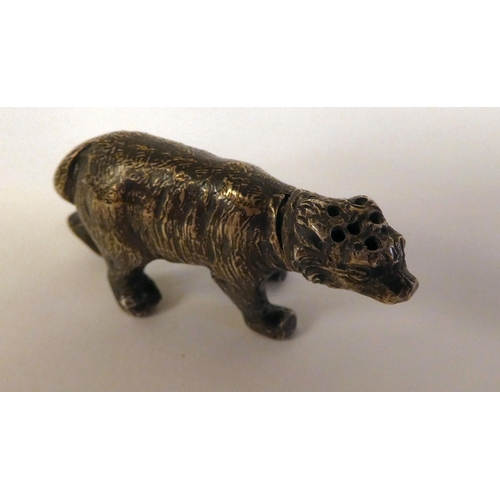 1 - An early 20thC silver miniature brown bear pepper pot  bears an indistinct marks & an import mar... 