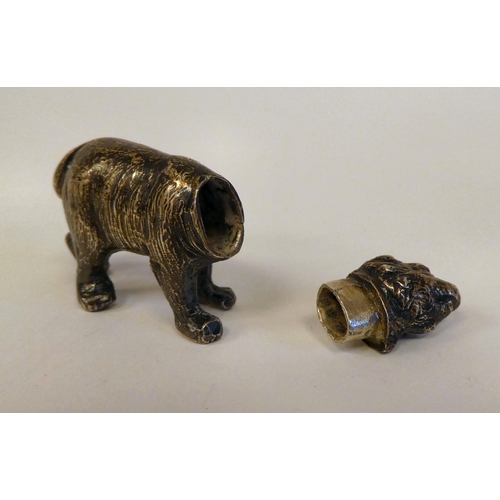 1 - An early 20thC silver miniature brown bear pepper pot  bears an indistinct marks & an import mar... 