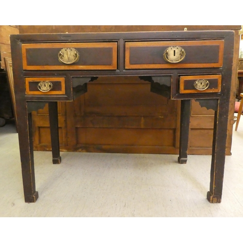 103 - A late 19th/early 20thC elm and fielded panelled kneehole work table, the mitred top over an arrange... 