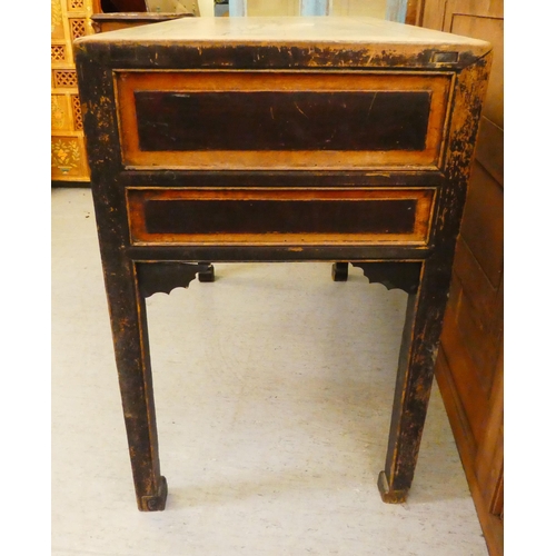 103 - A late 19th/early 20thC elm and fielded panelled kneehole work table, the mitred top over an arrange... 