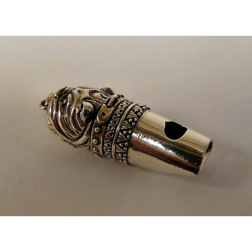 109 - A Sterling silver dog whistle, on a pendant ring 