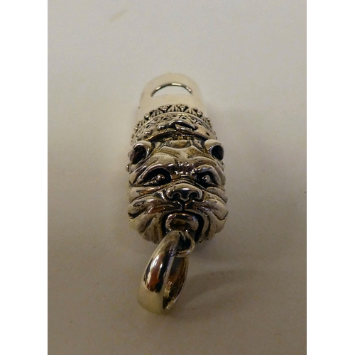 109 - A Sterling silver dog whistle, on a pendant ring 