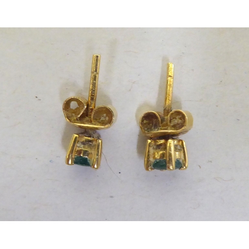 112 - A pair of 18ct gold emerald stud earrings