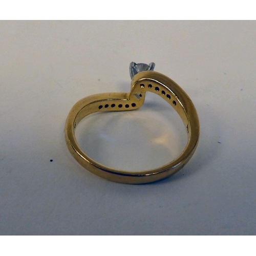 126 - An 18ct gold crossover set diamond ring 