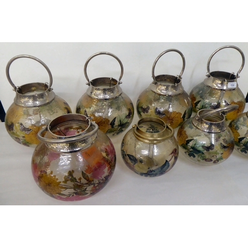 132 - A set of seven painted model glass T-light garden lanterns  largest 10