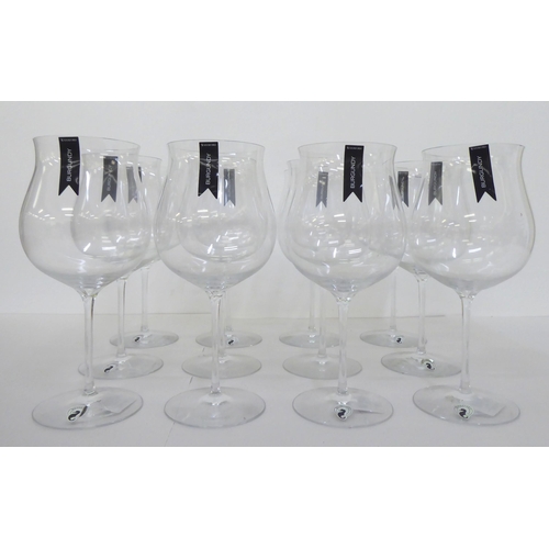 134 - A set of twelve Waterford crystal Burgundy pattern pedestal wine glasses