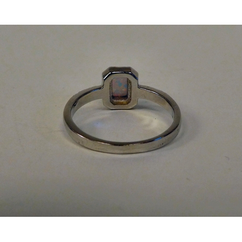 149 - A silver coloured metal opal and cubic zirconia set ring 