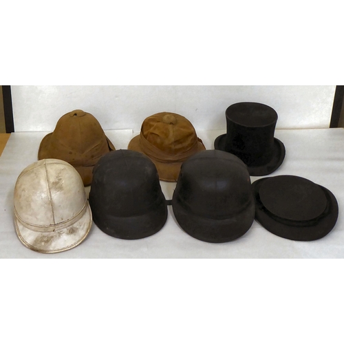 15 - A selection of formal and other hats/helmets: to include two tan coloured pith helmets