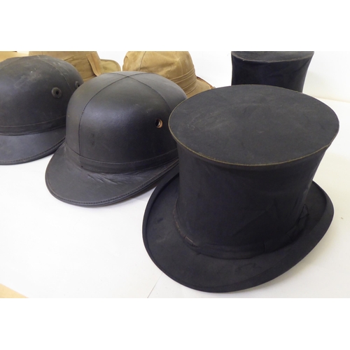 15 - A selection of formal and other hats/helmets: to include two tan coloured pith helmets