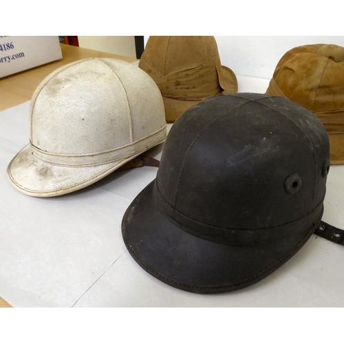 15 - A selection of formal and other hats/helmets: to include two tan coloured pith helmets