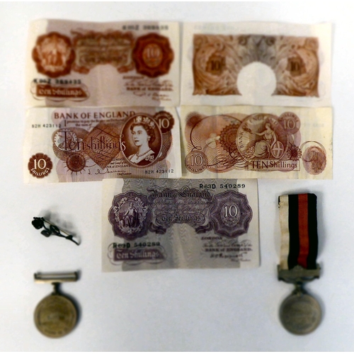 155 - Five 10/- banknotes, two circa 1950s medals; and a leaf brooch