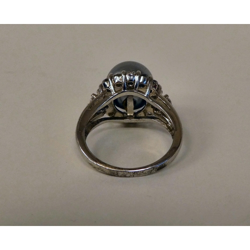 157 - A silver coloured metal ring, set with a river pearl and cubic zirconia 