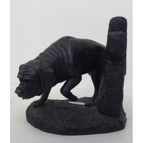 162 - After Mary Lang - a Limited Edition 062/500 composition bronze effect sculpture, a dog beside a head... 