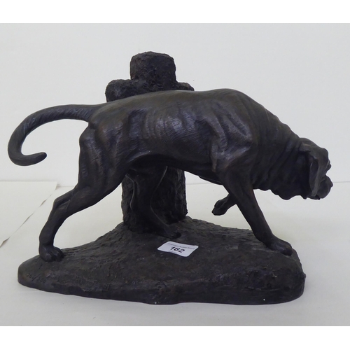 162 - After Mary Lang - a Limited Edition 062/500 composition bronze effect sculpture, a dog beside a head... 