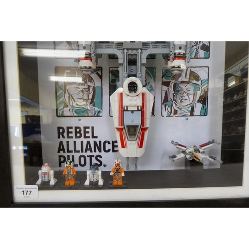 177 - A Lego Star Wars themed display, comprising four characters, a Y-Wink Resistance Starfighter, in a d... 