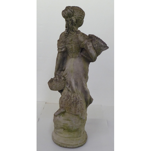 18 - A composition stone terrace figure, a woman carrying baskets, on a circular plinth  28