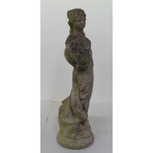 18 - A composition stone terrace figure, a woman carrying baskets, on a circular plinth  28